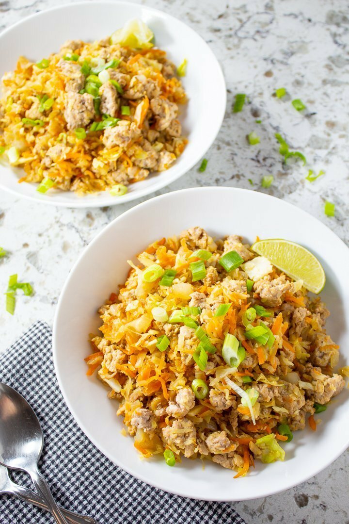 AIP, Paleo Cabbage Roll Bowls with sliced green onions and lime slices.