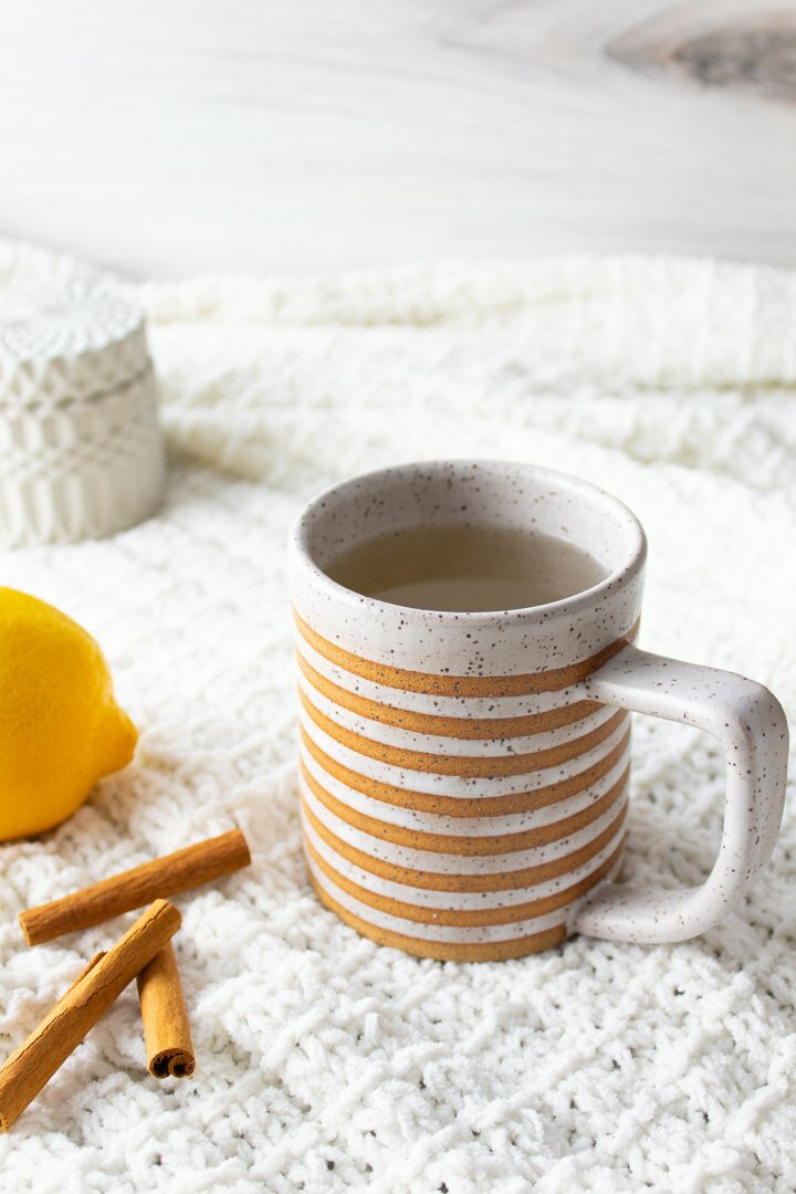 Spiced Honey Lemon Tea in a striped mug.