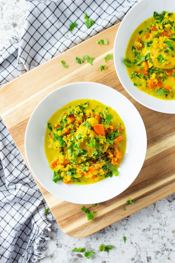 Turmeric Chicken and Cauli Rice served up in two white bowls.