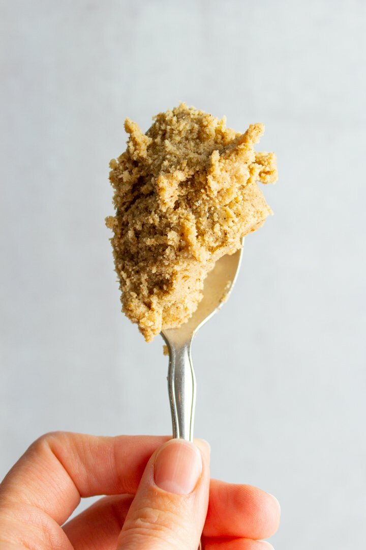 Chai cookie dough on a spoon.