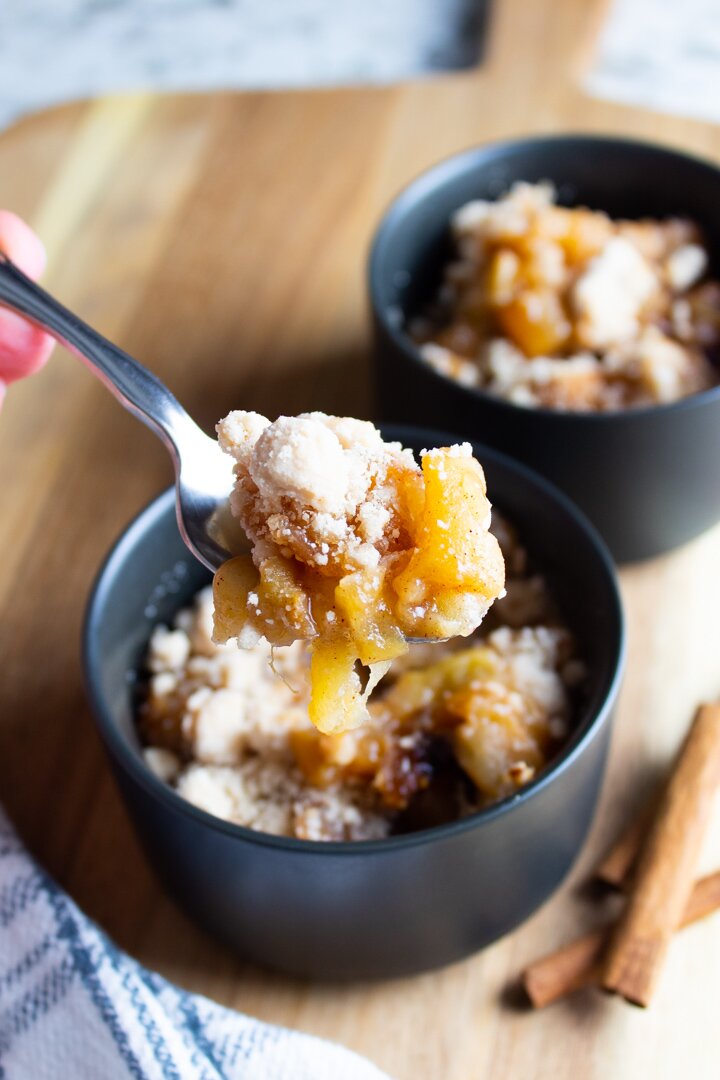 Close up of a spoonful of Crockpot AIP Apple Crumble.