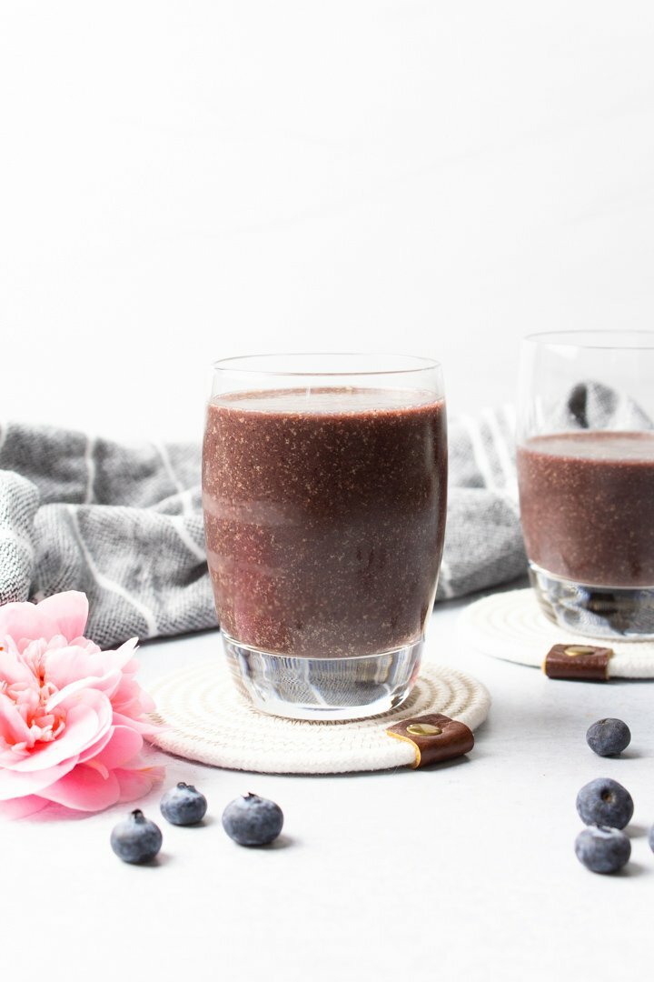 Straight shot of Blueberry Pineapple Smoothies in clear glasses..