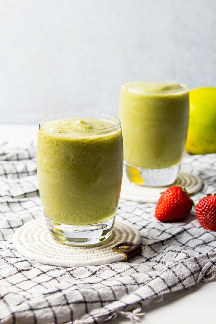 Strawberry Mango Green Smoothies in small glasses.